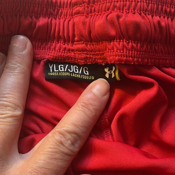 Under Armour red athletic shorts with black and grey on side of shorts. - Picture 2 of 5